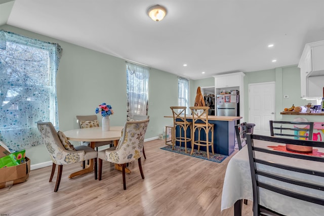 dining area with light wood-type flooring