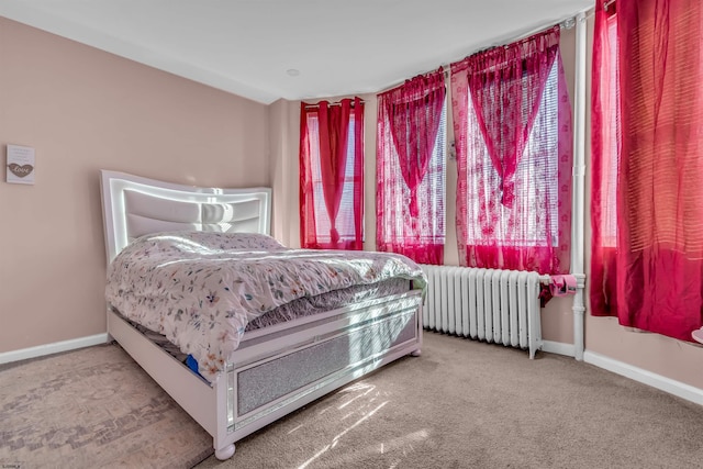 bedroom featuring carpet floors and radiator heating unit