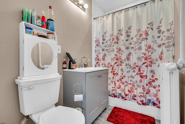 full bathroom with shower / bathtub combination with curtain, vanity, toilet, and radiator heating unit