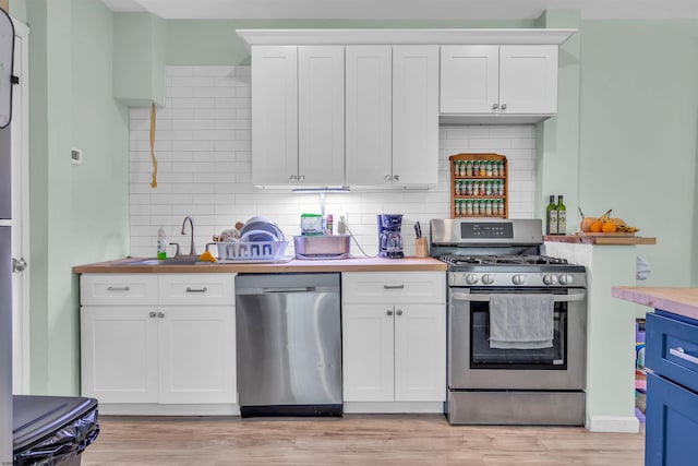 kitchen with white cabinetry and stainless steel appliances