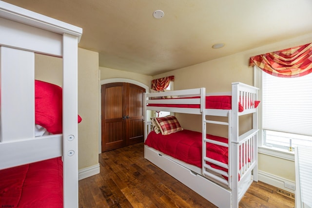 bedroom featuring dark wood-type flooring