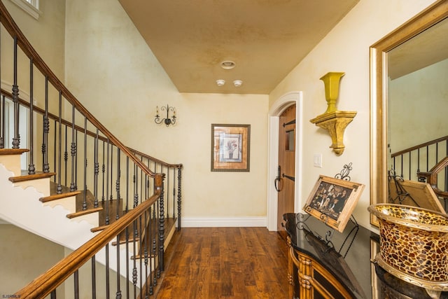 corridor with dark hardwood / wood-style floors