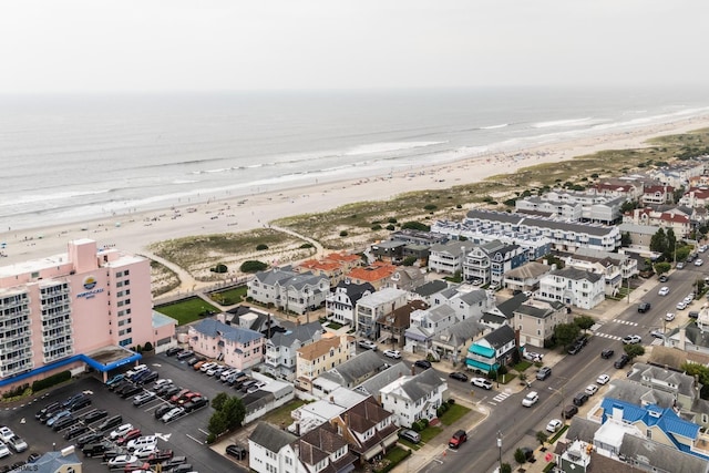 aerial view featuring a water view and a beach view