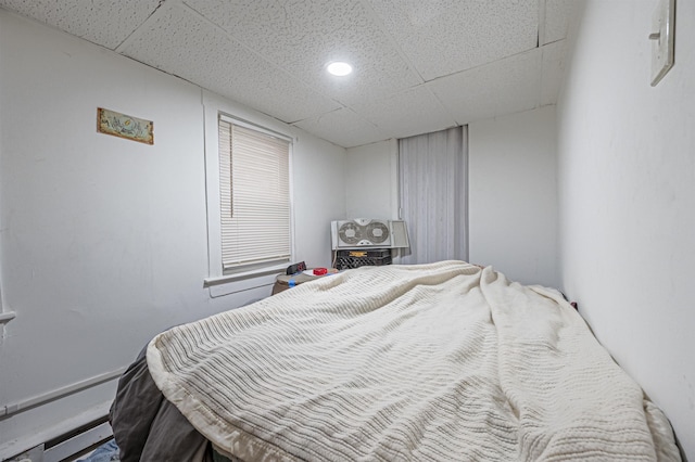 bedroom featuring a drop ceiling