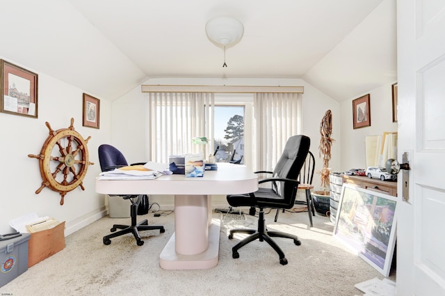 home office featuring carpet floors and vaulted ceiling