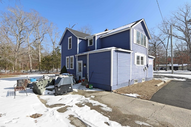 view of snow covered property