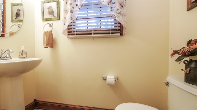 bathroom with sink and toilet