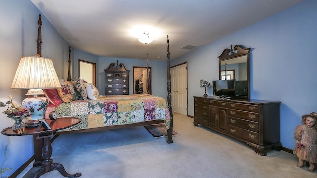 carpeted bedroom featuring a closet