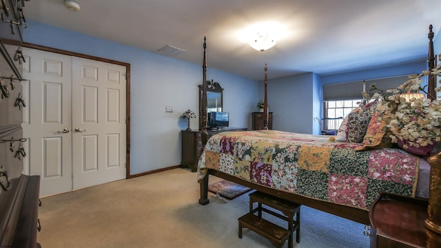 carpeted bedroom with a closet