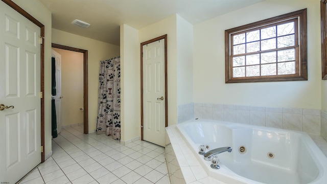 bathroom featuring tile patterned floors and separate shower and tub