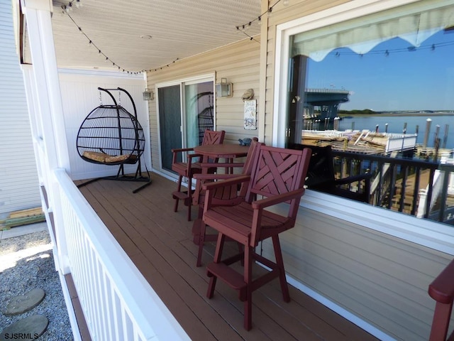 wooden deck featuring a water view