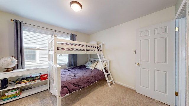 bedroom with light colored carpet