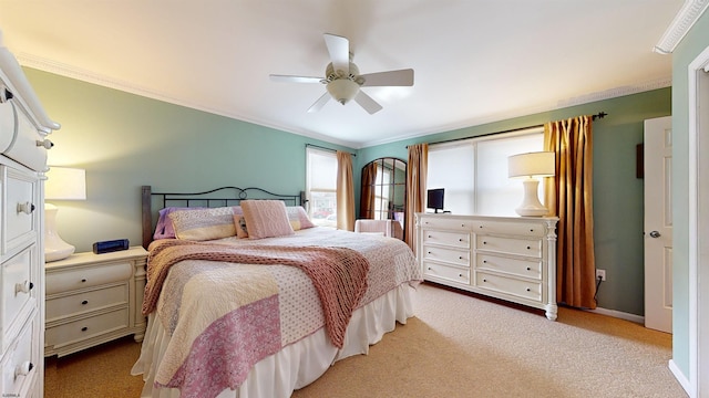 carpeted bedroom featuring crown molding and ceiling fan