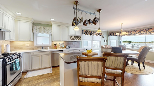 kitchen with sink, stainless steel appliances, and a healthy amount of sunlight