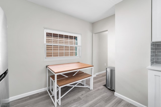 dining space with light wood-type flooring