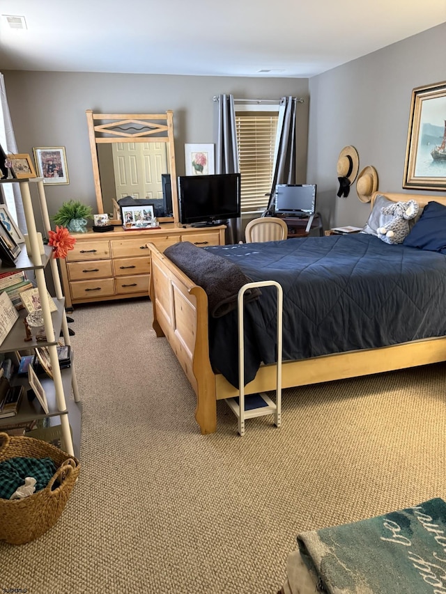 bedroom with light colored carpet