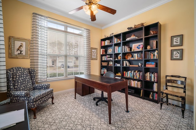 office area featuring ceiling fan, ornamental molding, and light colored carpet