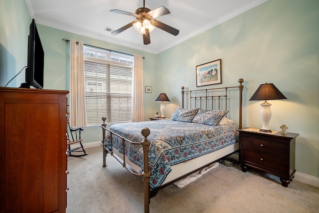 bedroom with light carpet, ornamental molding, and ceiling fan