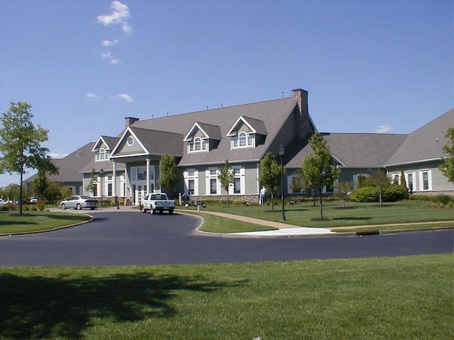 view of front of home with a front lawn