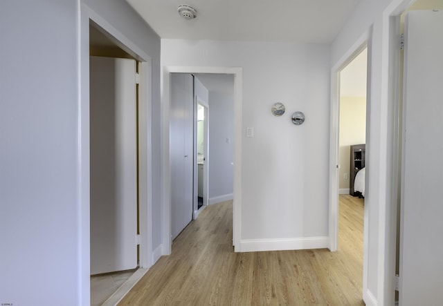 hall with light wood-type flooring