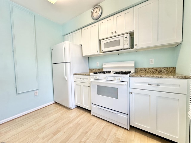 kitchen featuring white cabinetry, white appliances, stone countertops, and light wood-type flooring