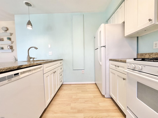 kitchen with sink, white cabinetry, decorative light fixtures, light wood-type flooring, and white appliances