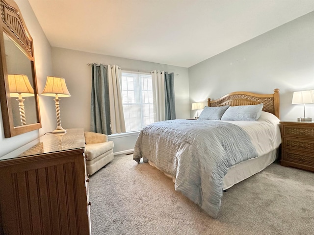 bedroom featuring light colored carpet