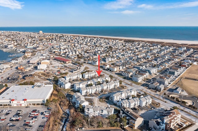 aerial view featuring a water view and a view of the beach