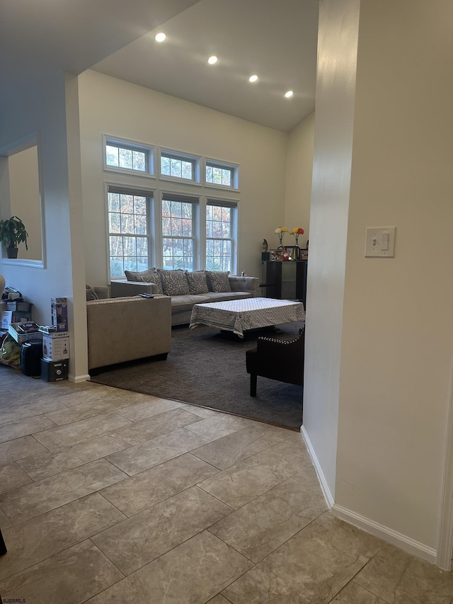 living room with a towering ceiling