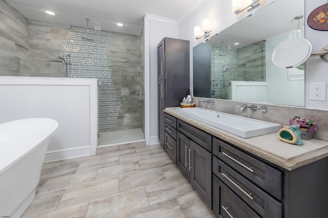 bathroom with vanity, crown molding, and plus walk in shower