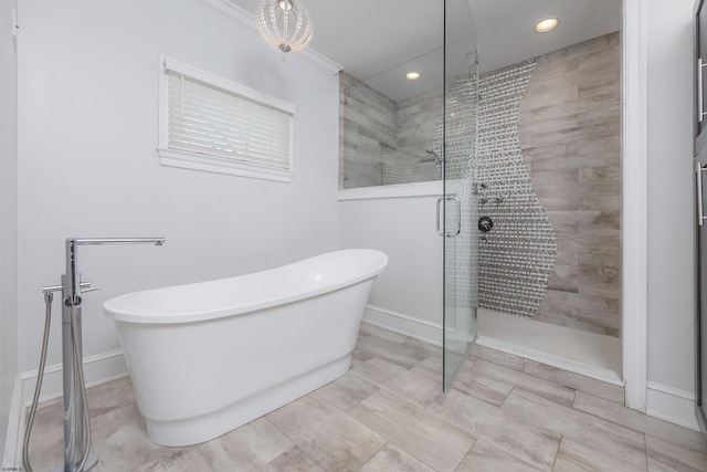 bathroom with separate shower and tub