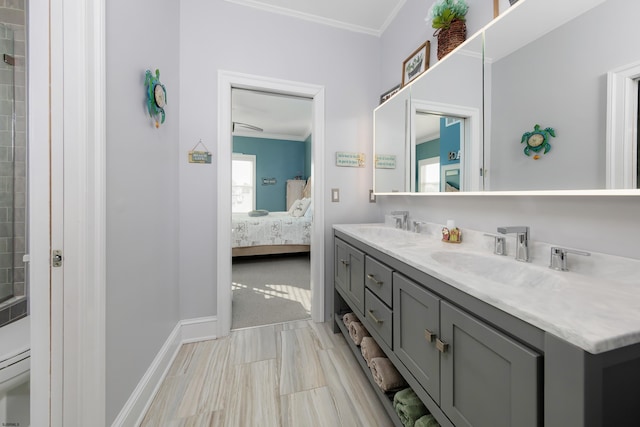 bathroom featuring crown molding, vanity, and toilet