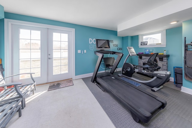 workout room with a healthy amount of sunlight and french doors