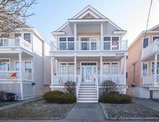 view of front of property with a balcony and covered porch