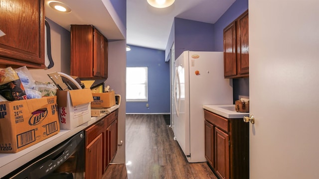 kitchen with dark hardwood / wood-style flooring, dishwasher, and white fridge