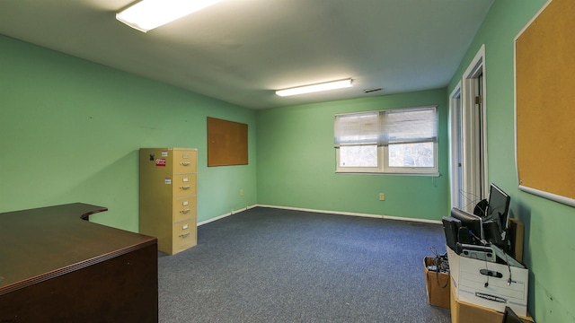 miscellaneous room with dark colored carpet