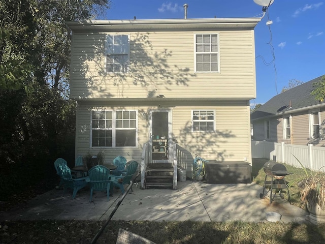 back of property featuring a patio