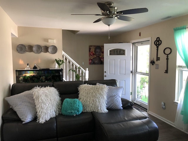 living room with wood-type flooring and ceiling fan