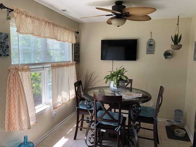 dining room with light tile patterned floors and ceiling fan