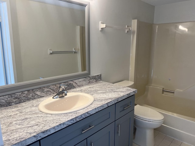 full bathroom with shower / tub combination, vanity, tile patterned floors, and toilet