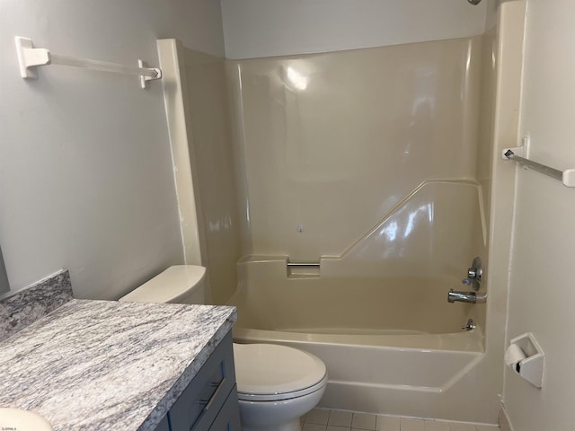 full bathroom with shower / tub combination, tile patterned floors, toilet, and vanity