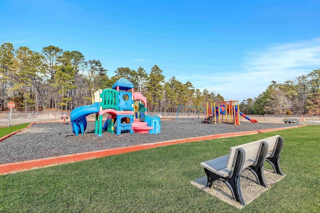 view of playground featuring a lawn