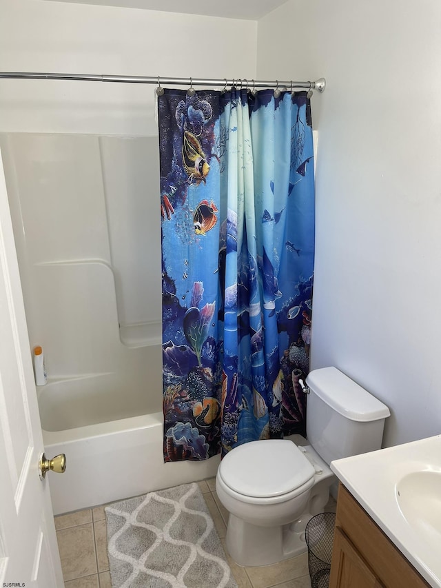 full bathroom featuring tile patterned flooring, vanity, shower / tub combo, and toilet