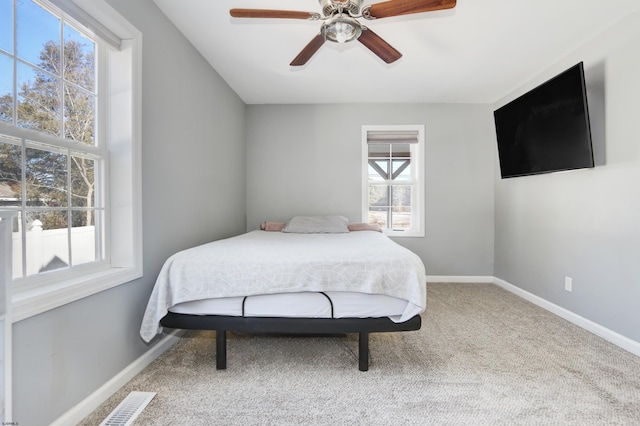 carpeted bedroom with ceiling fan