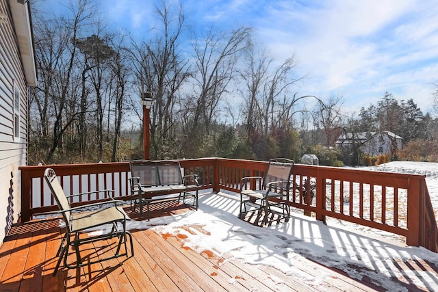 view of snow covered deck