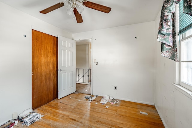 spare room featuring ceiling fan and light hardwood / wood-style floors