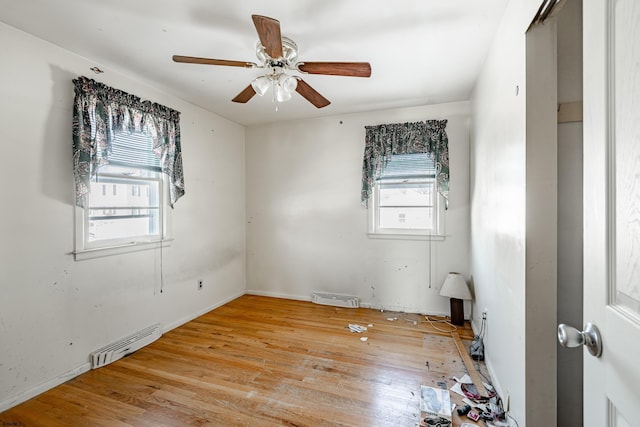 unfurnished room with ceiling fan and light hardwood / wood-style flooring