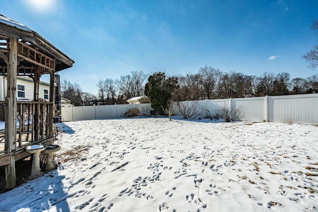 view of yard layered in snow