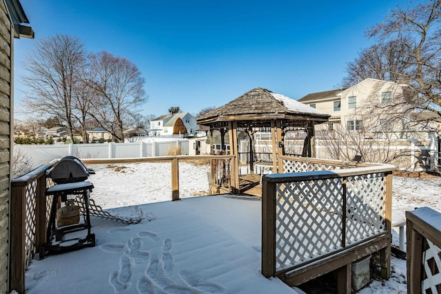 snow covered deck featuring a gazebo and grilling area