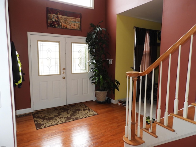 foyer with french doors and wood-type flooring